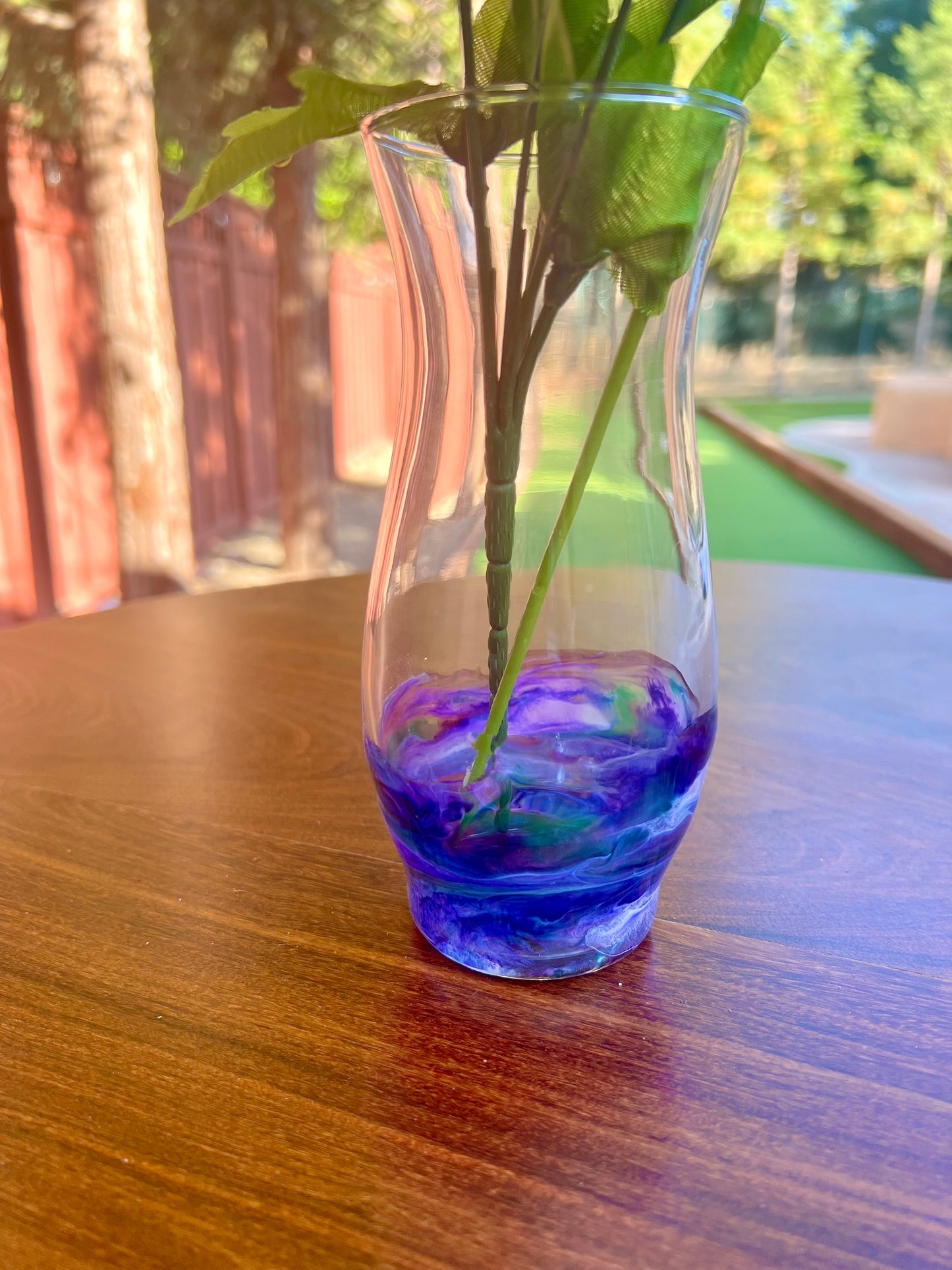 a flower in a vase on a table