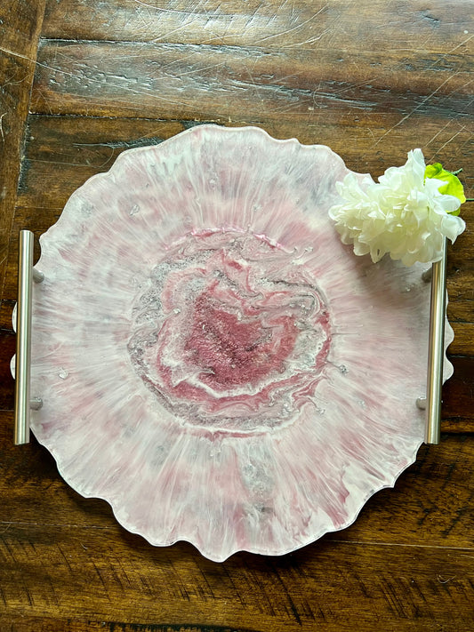 a white flower sitting on top of a wooden table