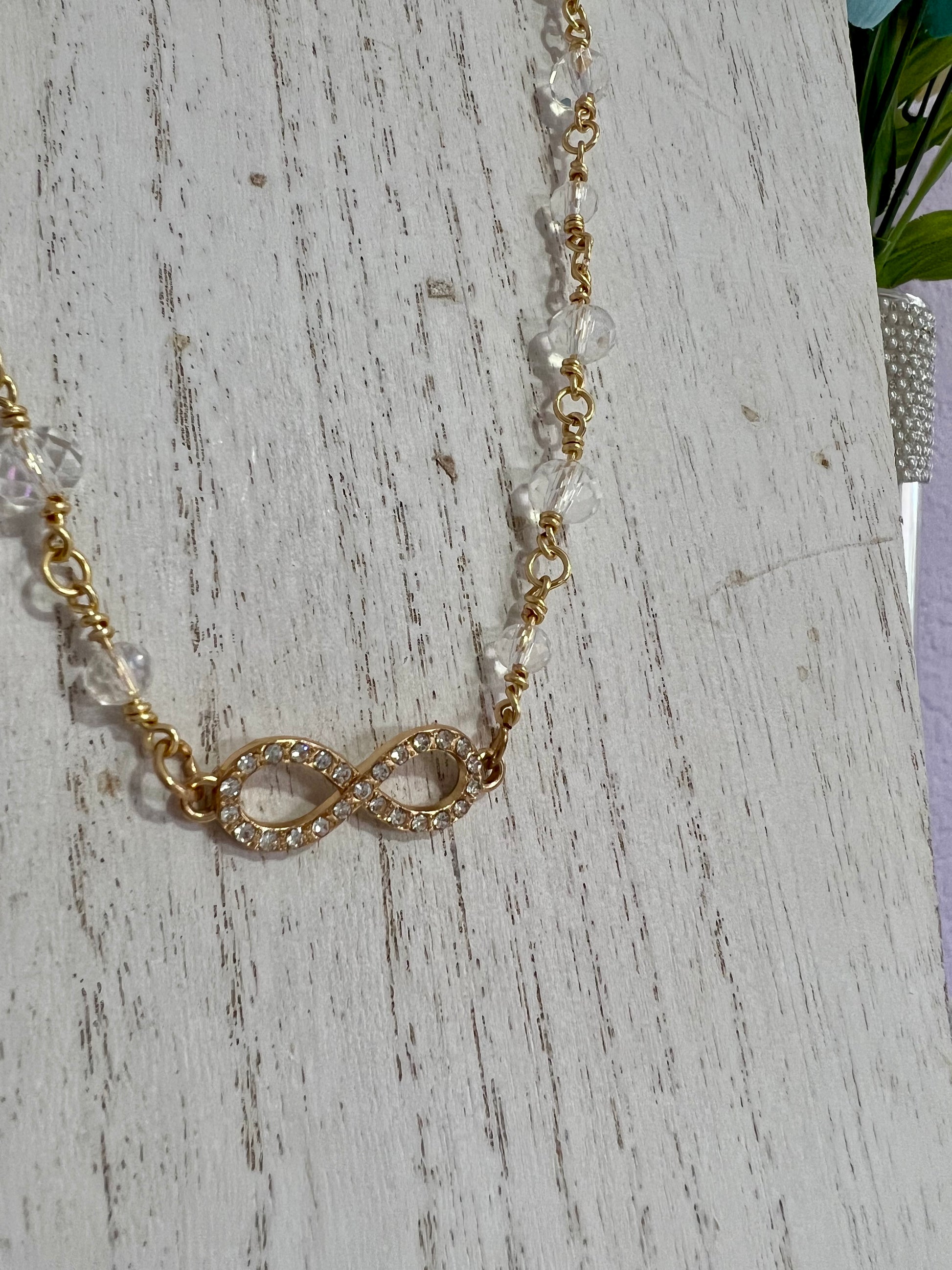 a close up of a necklace on a table